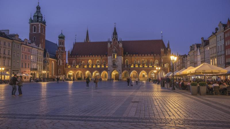 Main Market Square in Krakow with the Cloth Hall at dusk